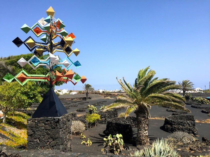 Cesar Manrique Jameos del Agua Lanzarote — artists volcanic cave transformation with white architecture, palm trees and turquoise natural pool