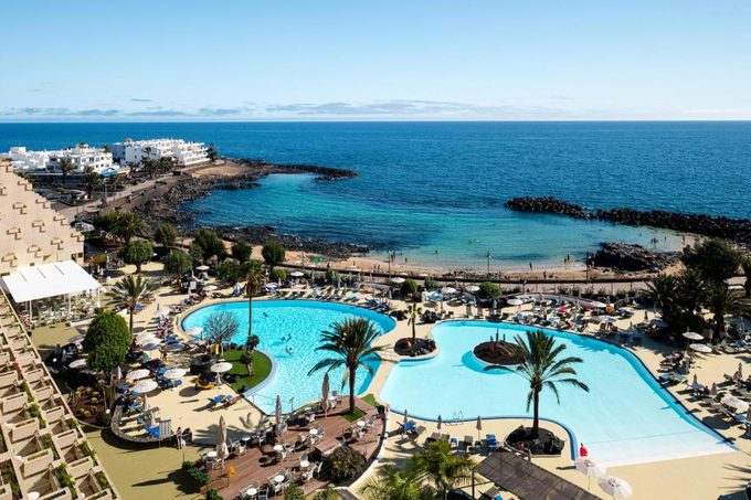 Grand Teguise Playa oceanfront hotel exterior — beachfront resort with live music near Playa del Jablillo Costa Teguise